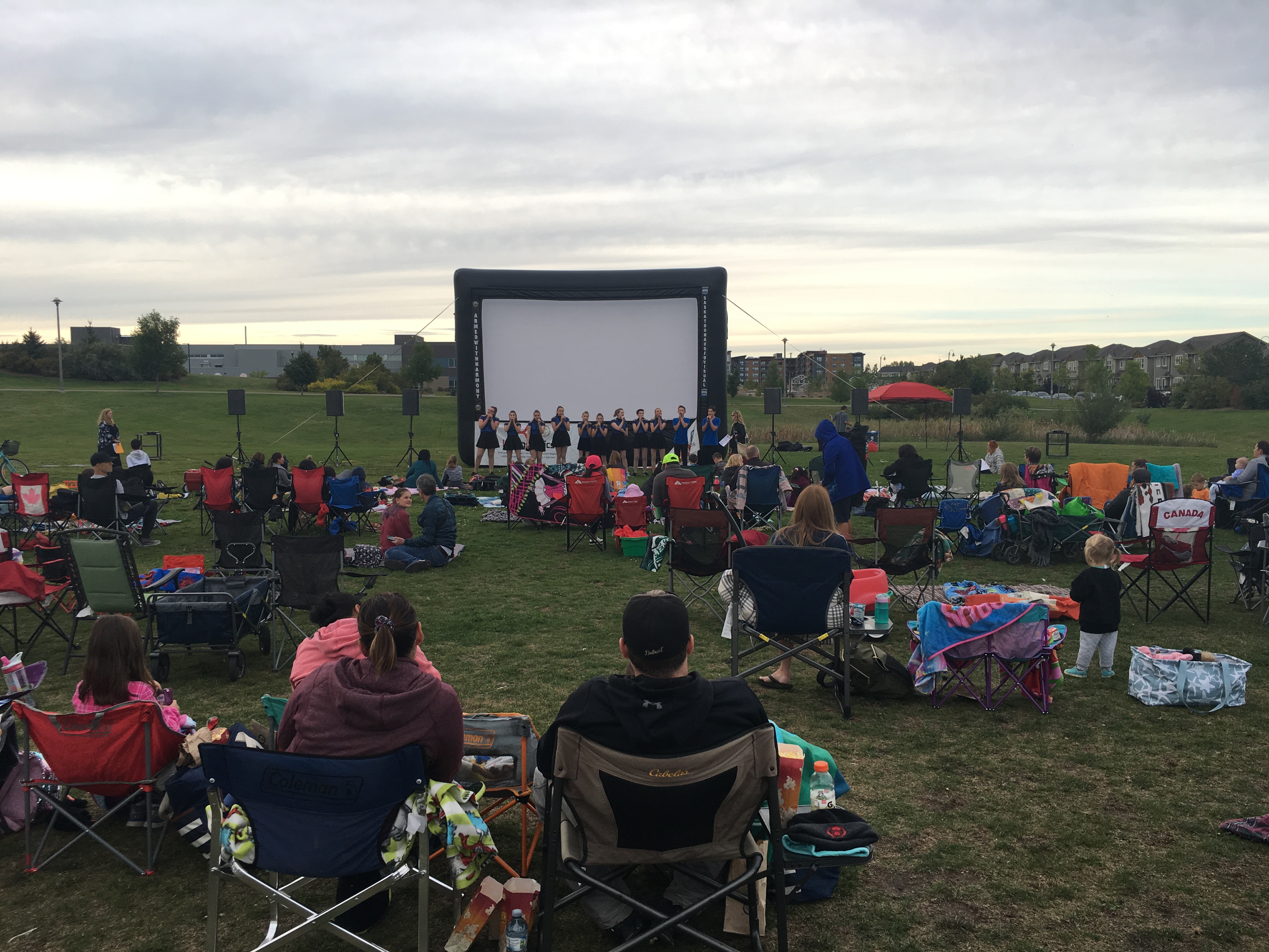 Saskatoon Saskatchewan YXE Pop Up Drive In Movie Screen Outdoor Theatre Cinema Under The Stars Armed With Harmony